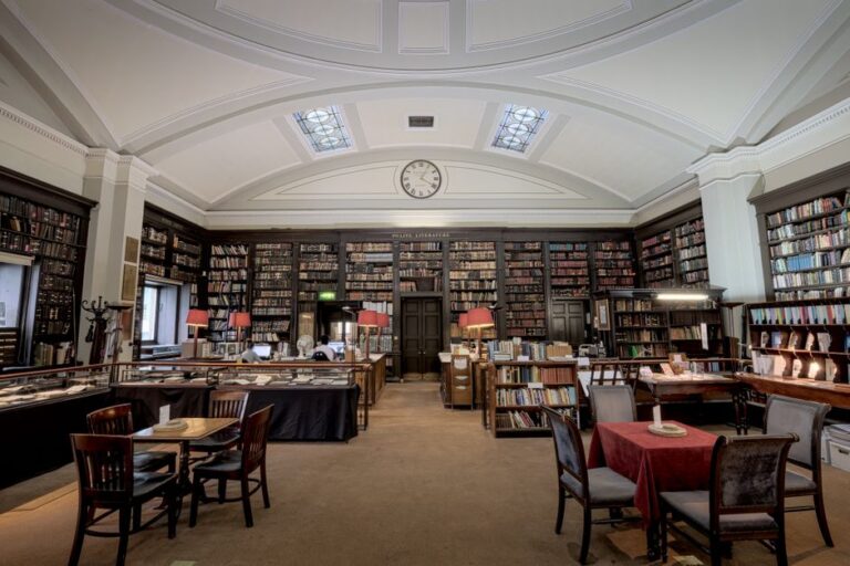 Explore the elegant and historic interior of a classic library in Manchester, England. Perfect for literature enthusiasts.